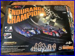 AFX Slot Car Set 21042 Endurance Champions with 2 Cars Complete W Box & Manuals