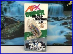 AFX Super Magna-traction Chrome Ford Escort 1103-850, Brand New, Damaged Package