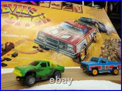 Aurora AFX Devil's Ditch Performance Track Slot Car Set Tomy Jurassic Park Truck