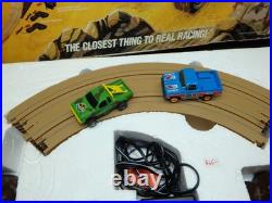 Aurora AFX Devil's Ditch Performance Track Slot Car Set Tomy Jurassic Park Truck