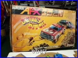 Aurora AFX Devil's Ditch Performance Track Slot Car Set Tomy Jurassic Park Truck
