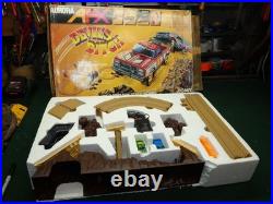 Aurora AFX Devil's Ditch Performance Track Slot Car Set Tomy Jurassic Park Truck