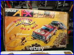 Aurora AFX Devil's Ditch Performance Track Slot Car Set Tomy Jurassic Park Truck