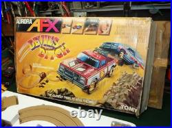 Aurora AFX Devil's Ditch Performance Track Slot Car Set Tomy Jurassic Park Truck