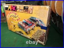 Aurora AFX Devil's Ditch Performance Track Slot Car Set Tomy Jurassic Park Truck