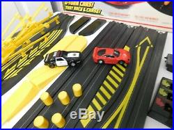 Tyco Race and Chase with u-turn cars and double cross jump