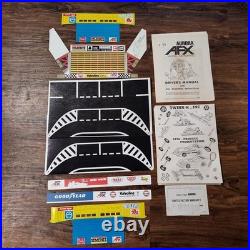 Vintage Aurora AFX slot car collection with race tracks & controls